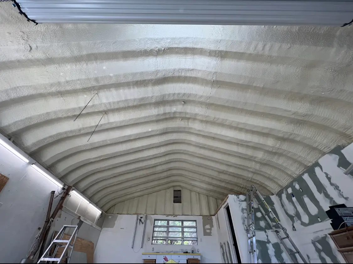 Spray polyurethane foam applied to the underside of a metal roof deck in Riviera Beach